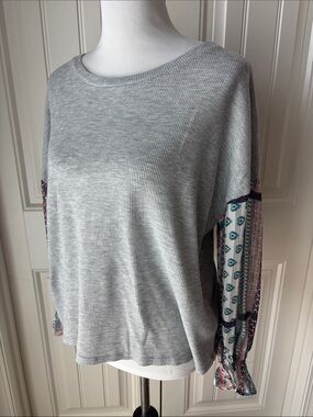 Skies Are Blue Pale Blue Knit Top with Gold Logo